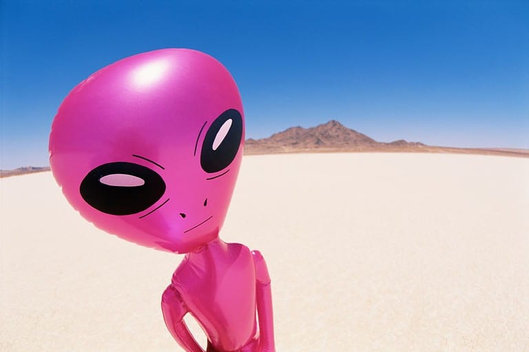 Funny pink alien in the desert.