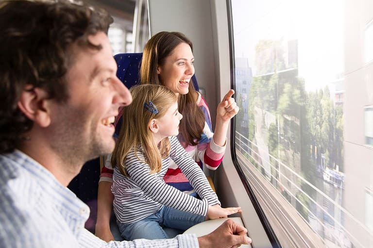 Family on train looking on window. Explore Minnesota's Bluff Country by Train!