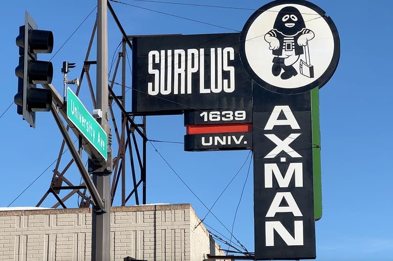 Outdoor building sign for Ax-Man Surplus Stores in St. Paul, Minnesota.