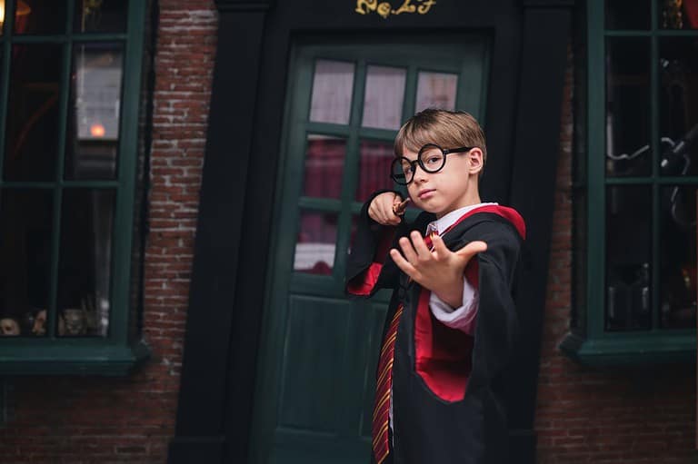 Boy cosplays as Harry Potter. Unleash your inner wizard today! Discover Harry Potter-themed escape rooms in Minnesota that will make you feel like you're at Hogwarts.