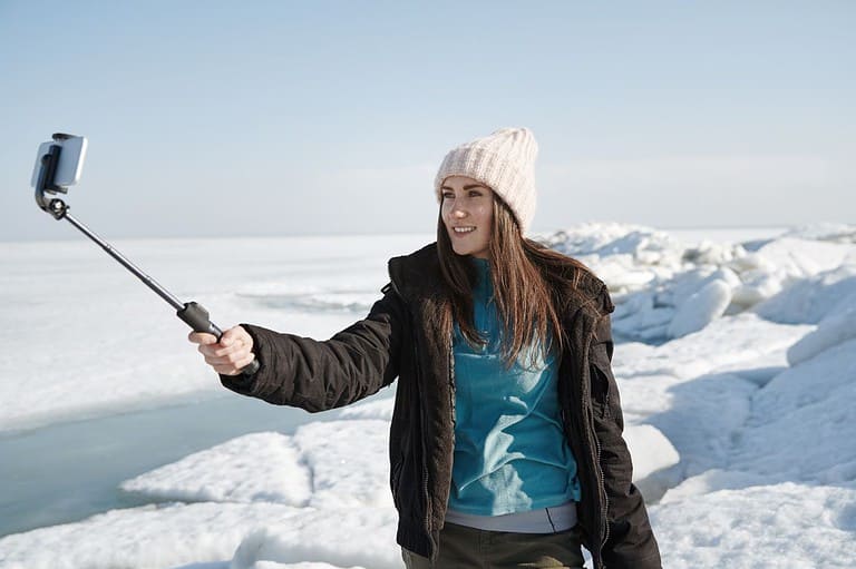Woman takes a selfie on the ice.