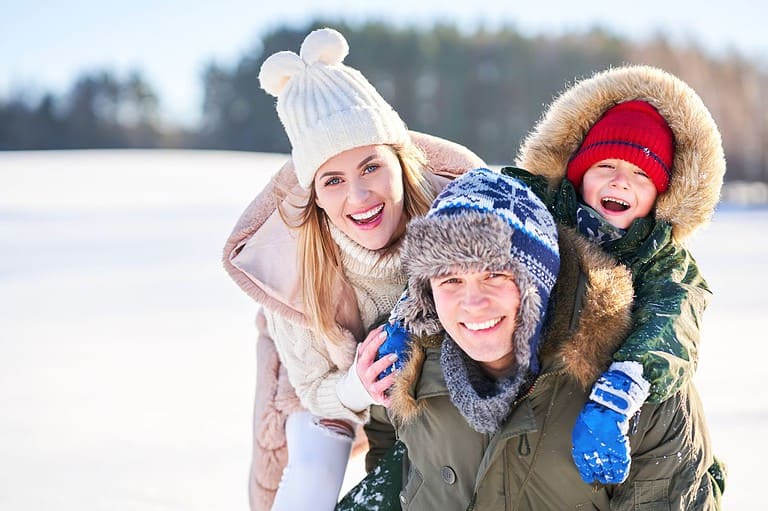 A young family enjoys fun at the Saint Paul Winter Carnival