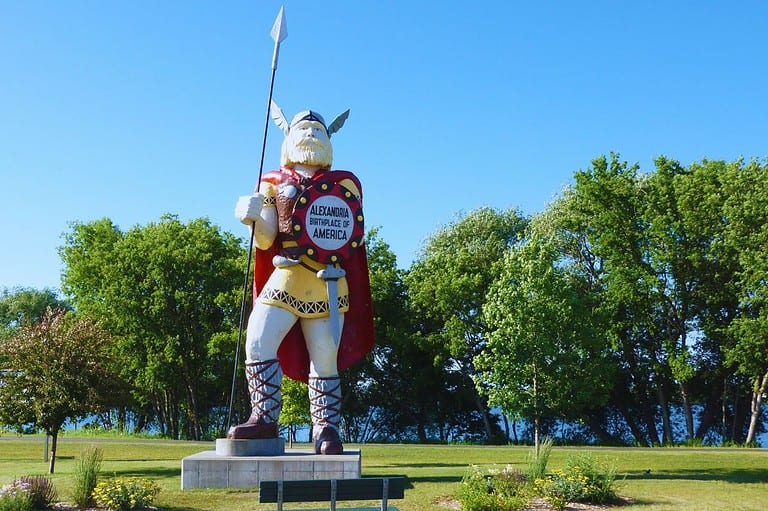 Big Ole statue on a sunny day in Alexandria, Minnesota. Discover the towering Big Ole Viking statue and the quirky Viking history of Alexandria, Minnesota! This is a Minnesota icon you can't miss!
