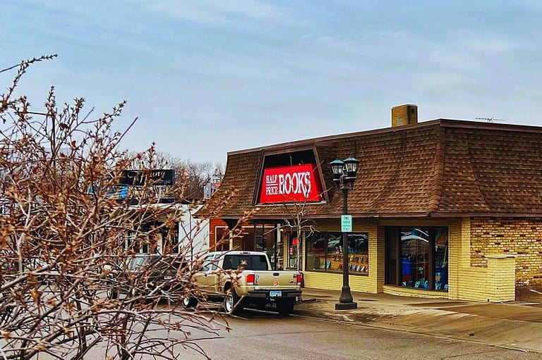 Exterior of Half Price Books on a winter day. Minnesotans love this bookstore! Dive into a world of endless stories at Half Price Books in the Highland Park neighborhood of St. Paul.