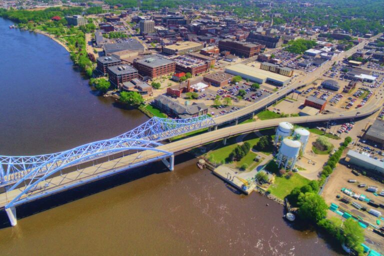 Drone photo of La Crosse, Wisconsin on a summer day. The Mississippi River is seen as is most of the downtown area.