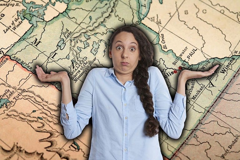Confused woman looking at map of Minnesota. Ready to find your dream home? Check out the best places to live in America, according to the latest ranking!