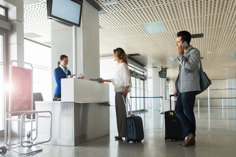 People boarding at an airport. Elevate your flying experience! Discover why boarding early is the secret to a stress-free journey in our ultimate guide.