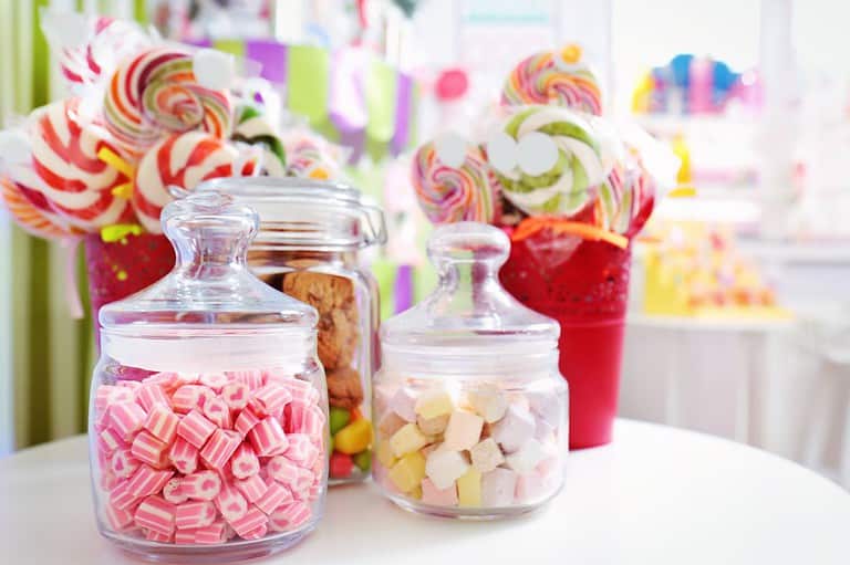Colorful candy in jars. Get ready for a sugar rush like no other! Discover the sweet wonders of Candyland, where childhood dreams come alive and taste buds rejoice.