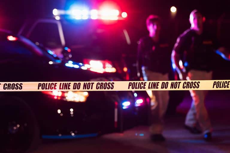 Police at a crime scene. Based on crime rates, these are Minnesota's most dangerous cities. The good news? Cities are uniting to build safer communities for all.