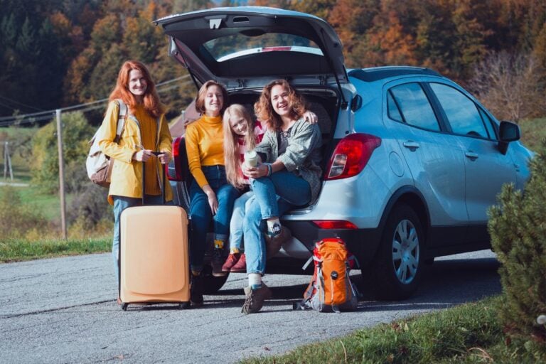 Minnesota family in their car ready for a day trip. Day trips from the Twin Cities that your family will love! From charming river towns to outdoor adventures, there's something for everyone.