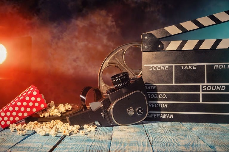 Popcorn, film camera and clapper. Get ready for an unforgettable experience at the 43rd Annual Minneapolis St. Paul International Film Festival!