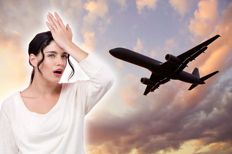 Woman slapping her forehead. Plane flying. You won't believe these shocking airplane mistakes that drive flight attendants crazy! Learn how to avoid them for a smoother flight.