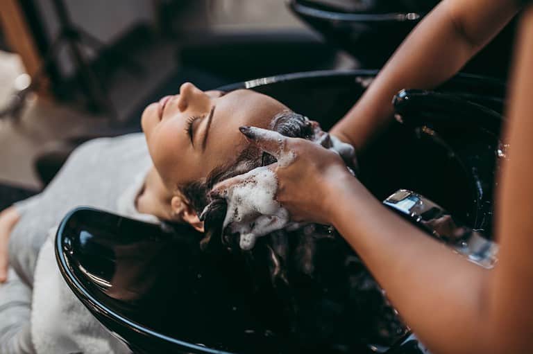 Relax hair salon experience for a woman. When was the last time your haircut became the highlight of your trip? Get a trim on your Midwest vacation and experience the difference!
