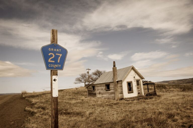 Abandoned farm house. Uncover the eerie secrets of Iowa's ghost towns on a haunting adventure through time! Each abandoned town has its own story.