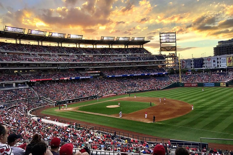 Baseball game in an Iowa open air stadium. Discover the heart-pounding thrills and unforgettable experiences that await you in Iowa's exhilarating sports adventures!