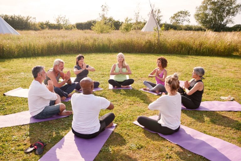 Group of yoga students in Iowa. Unwind, recharge, and embark on a transformative journey with Iowa's awe-inspiring retreats and wellness adventures.