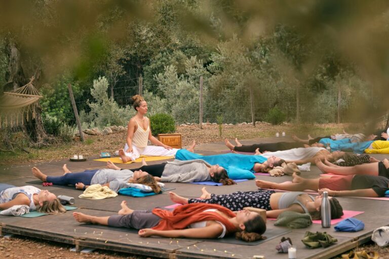 Woman teaching yoga in the woods of Wisconsin. Discover the serenity of Wisconsin's breathtaking retreats and wellness escapes, where nature's beauty and self-discovery intertwine.