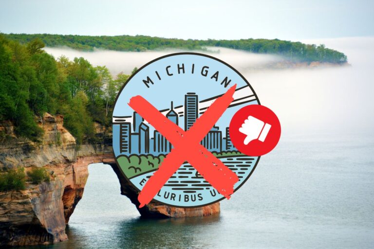 Michigan coast line with state seal crossed out by emoji thumbs down. From the boring seasons to the terrible food, this state will leave you utterly underwhelmed. Think we're being serious? Read to find out!