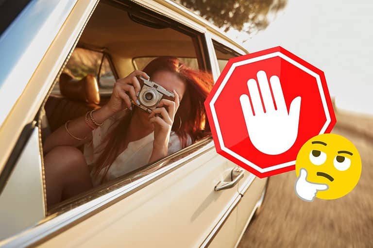 Woman with camera pointing out window during a drive. Don't let these common mistakes ruin your summer road trip! Check out these 10 essential tips to make your journey unforgettable!