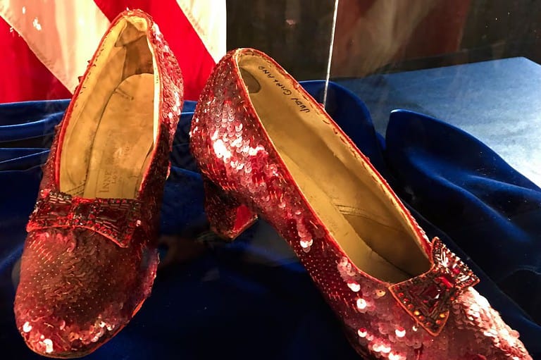 A pair of iconic ruby slippers, famously worn by Judy Garland in the beloved classic "The Wizard of Oz," sparkle under the spotlight at an FBI news conference held on September 4, 2018, in Brooklyn Center, Minnesota. The dazzling shoes, which were infamously stolen from the Judy Garland Museum in Grand Rapids, Minnesota, in 2005, have been at the center of a captivating Hollywood mystery for nearly two decades. In a shocking twist, an indictment unsealed on Sunday, March 17, 2024, revealed that a second man has been charged in connection with the audacious heist, shedding new light on the long-running investigation into the missing piece of cinematic history. As the case continues to unfold, the enduring allure of these legendary slippers remains as enchanting as ever, a testament to the enduring magic of "The Wizard of Oz" and the timeless appeal of Hollywood memorabilia.