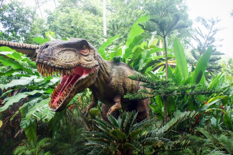 Dinosaur statue. Putt your way through a prehistoric adventure at Tee-Rex Mini Golf! This dino-sized mini golf course in Iowa is perfect for the whole family.