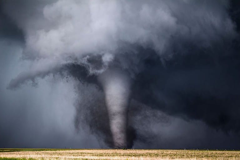 Tornado in corn field in Iowa. Tornado season isn't what you think! Keep your family safe. Get the shocking truth about when and where these deadly storms REALLY strike.