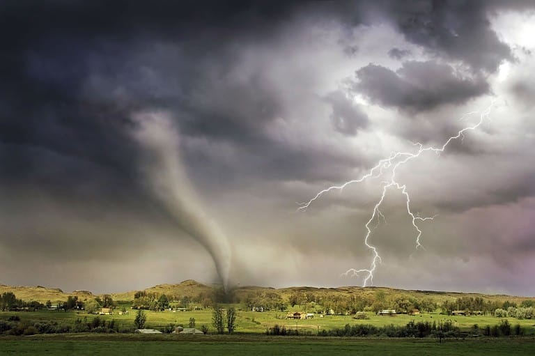 Lightning and tornado in Kansas field. Severe Weather Smarts: Is a tornado heading your way? Learn these warning signs to keep you and your family safe!