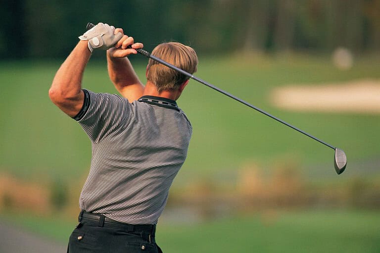 Man golfing at Breezy Point Golf Course in Brainerd, MN. Escape to the shores of Pelican Lake and experiences a golfers paradise at Breezy Point Resort: the ultimate Minnesota family getaway!