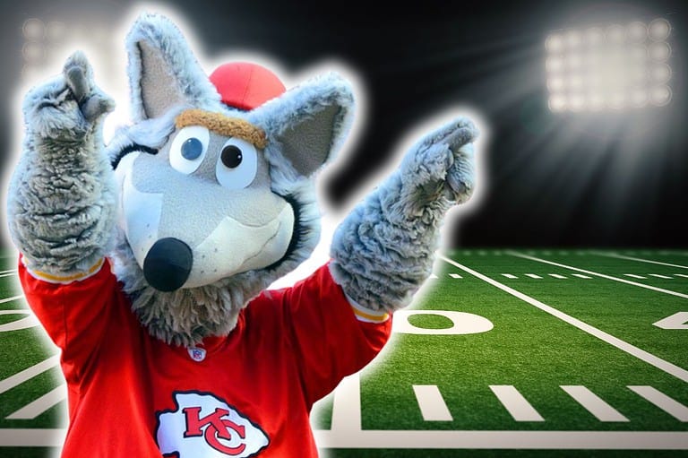 KC Mascot on football field. Have you ever wondered why the Kansas City Chiefs mascot is a wolf? We've got the inside scoop! Learn all about this iconic mascot.
