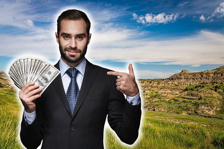 Rich man holding man in North Dakota. Have you ever wondered: why is North Dakota so rich? Discover the secrets behind Nodak's booming economy and high quality of life!