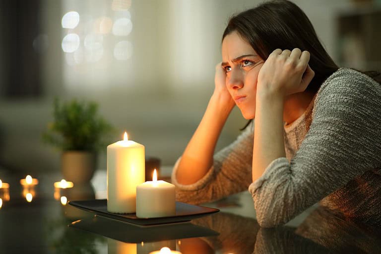Frustrated Iowa woman during power outage. Don't let a power outage leave you in the dark! Check out these tips to stay safe, comfortable, and connected when the lights go out.