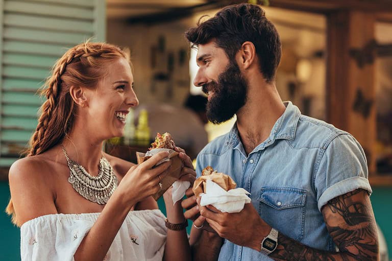 Minnesota couple enjoying food. Embark on a mouthwatering journey through Minnesota's diverse culinary scene, where folks come together for unforgettable food experiences.