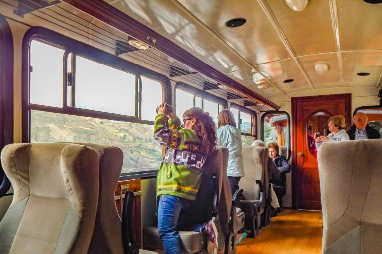 People riding a train. All aboard the Borealis train! Sit back, relax, and enjoy the 7-hour and 24-minute ride from St. Paul to Chicago for just $41.
