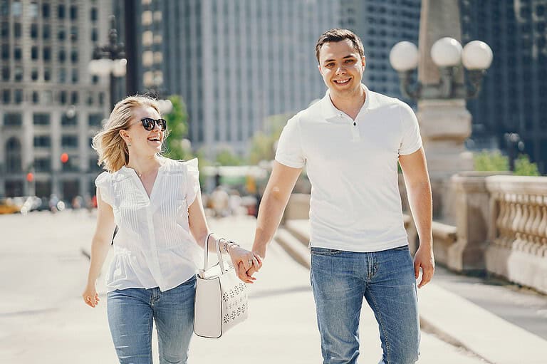 Couple walking in Chicago, IL. Get ready to fall head over heels for this Midwest metropolis. It's been named America's most walkable city.