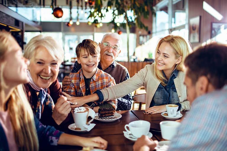 Minnesota family eating at a restaurant in Maple Grove. Get ready to dig in! "No Stove - Maple Grove" is serving up a smorgasbord of delicious dining options in Minnesota.