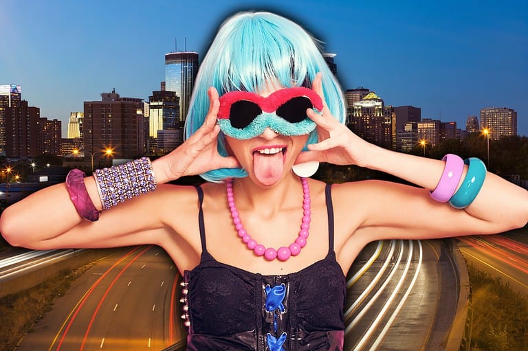 Weird woman in front of downtown Minneapolis skyline at night. Discover the unconventional side of Minneapolis with these 11 weird adventures and fun things to do! Ready to make some memories?