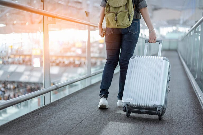 Mercedes Rodriguez with luggage at MSP International Airport in Minnesota. One Minneapolis woman's trip was almost ruined. Breeze through TSA with our expert packing tips – don't let these items ruin your trip!