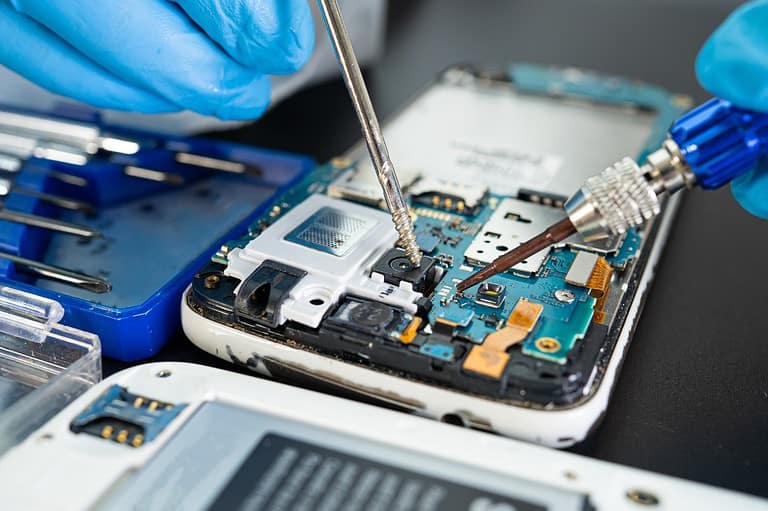 Phone being dissected. Can the TSA legally search your phone at the airport? The shocking answer might surprise you. Learn your rights now!