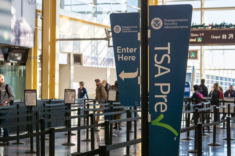 TSA Pre sign at MSP International Airport in Minnesota. What the heck are TSA Agents really thinking about you? Uncover the hidden clues that could make or break your airport security experience!
