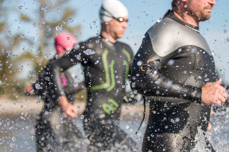 Swimmers in Winona, MN. Calling all triathletes! Get ready for an epic weekend of swimming, biking, and running at the TRINONA triathlon!