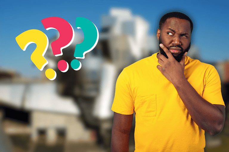 Confused Minneapolis man in front of the ugliest building in Minnesota. Is this the most controversial building in Minnesota? Discover the story behind this Minneapolis icon and decide for yourself!