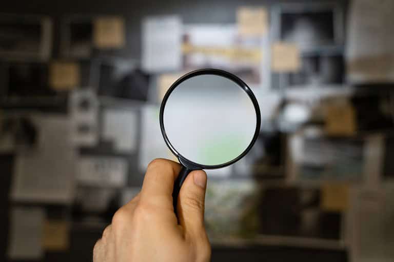 Magnifying glass in detective's office. Calling all detectives! Join the thrilling "Clue: A Walking Mystery" game and uncover Chicago's secrets while solving a murder.