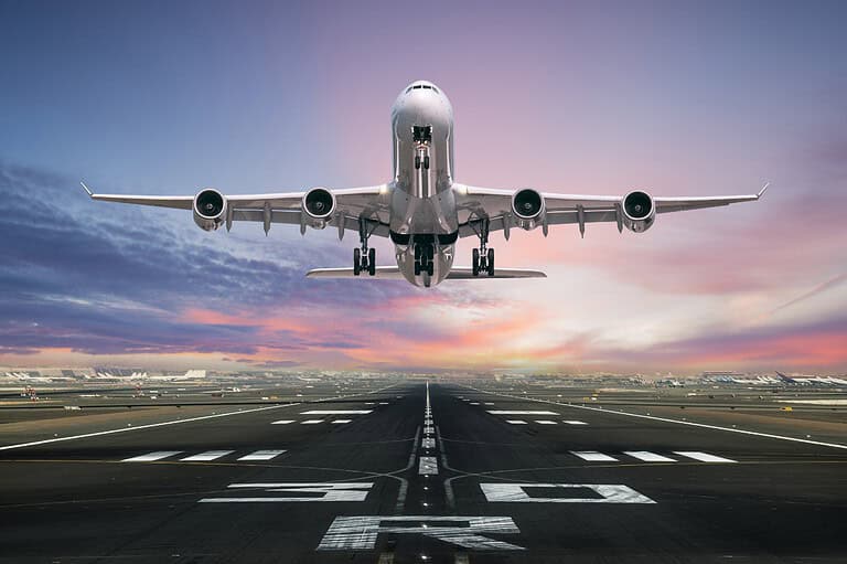 Plane taking off from runway. Discover the two types of no-fly lists that could ground your travel plans indefinitely – and how to avoid them!