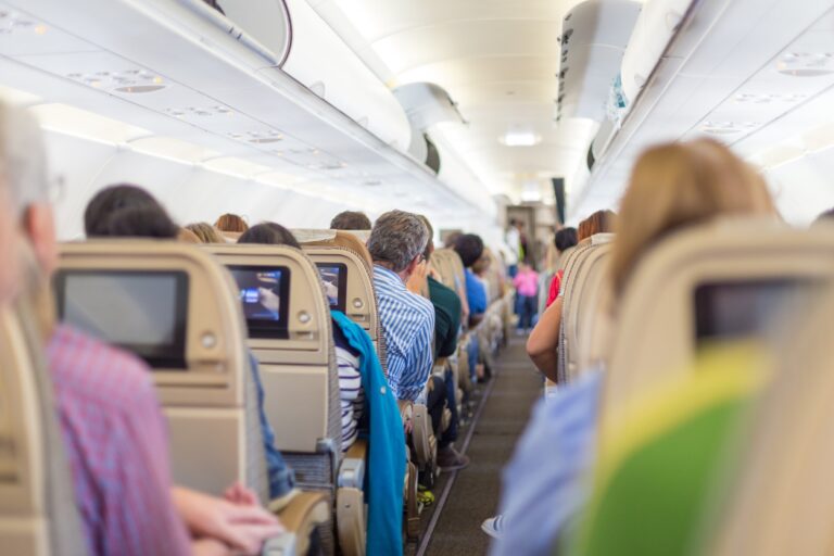 Crowded airplane. Worried about getting sick? Unlock the secret to germ-free flying and arrive at your destination healthier than ever before!